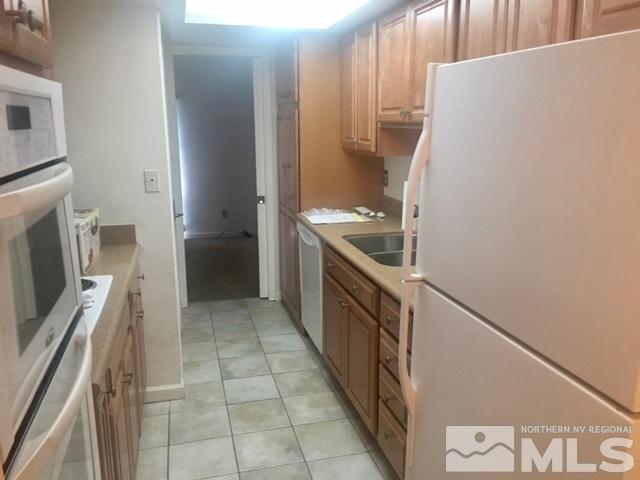 1937 South Villa Way Reno, NV 89509 - Photo 5 of 21 a kitchen with a stove and a refrigerator