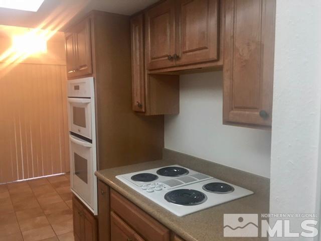 1937 South Villa Way Reno, NV 89509 - Photo 7 of 21 a kitchen with a stove and a refrigerator