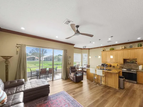 a large kitchen with a table and chairs