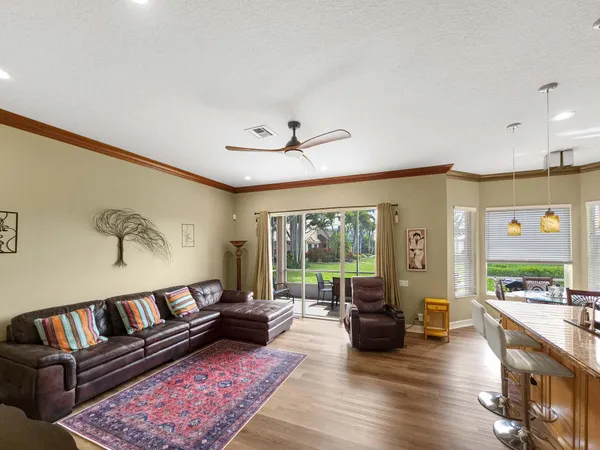 a large kitchen with stainless steel appliances granite countertop a sink stove and refrigerator