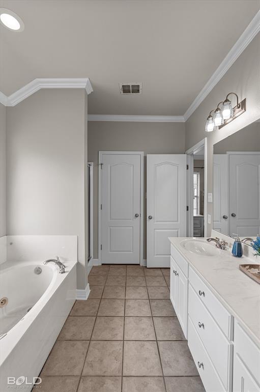 116 Augusta Avenue Benton, LA 71006 - Photo 24 of 38 a spacious bathroom with a bathtub and a sink
