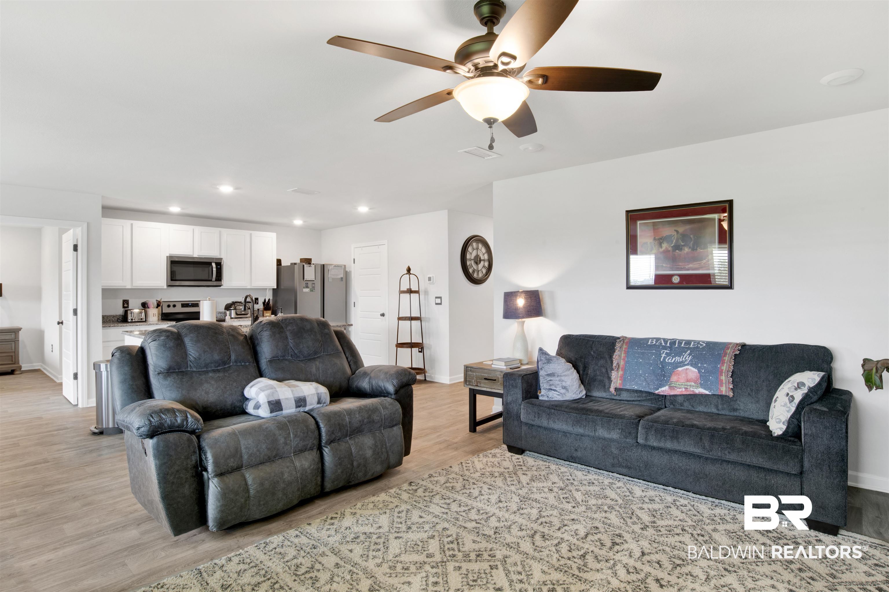 14731 Forsythia Loop Silverhill, AL 36576 - Photo 10 of 25 Living room with ceiling fan and light hardwood / wood-style flooring