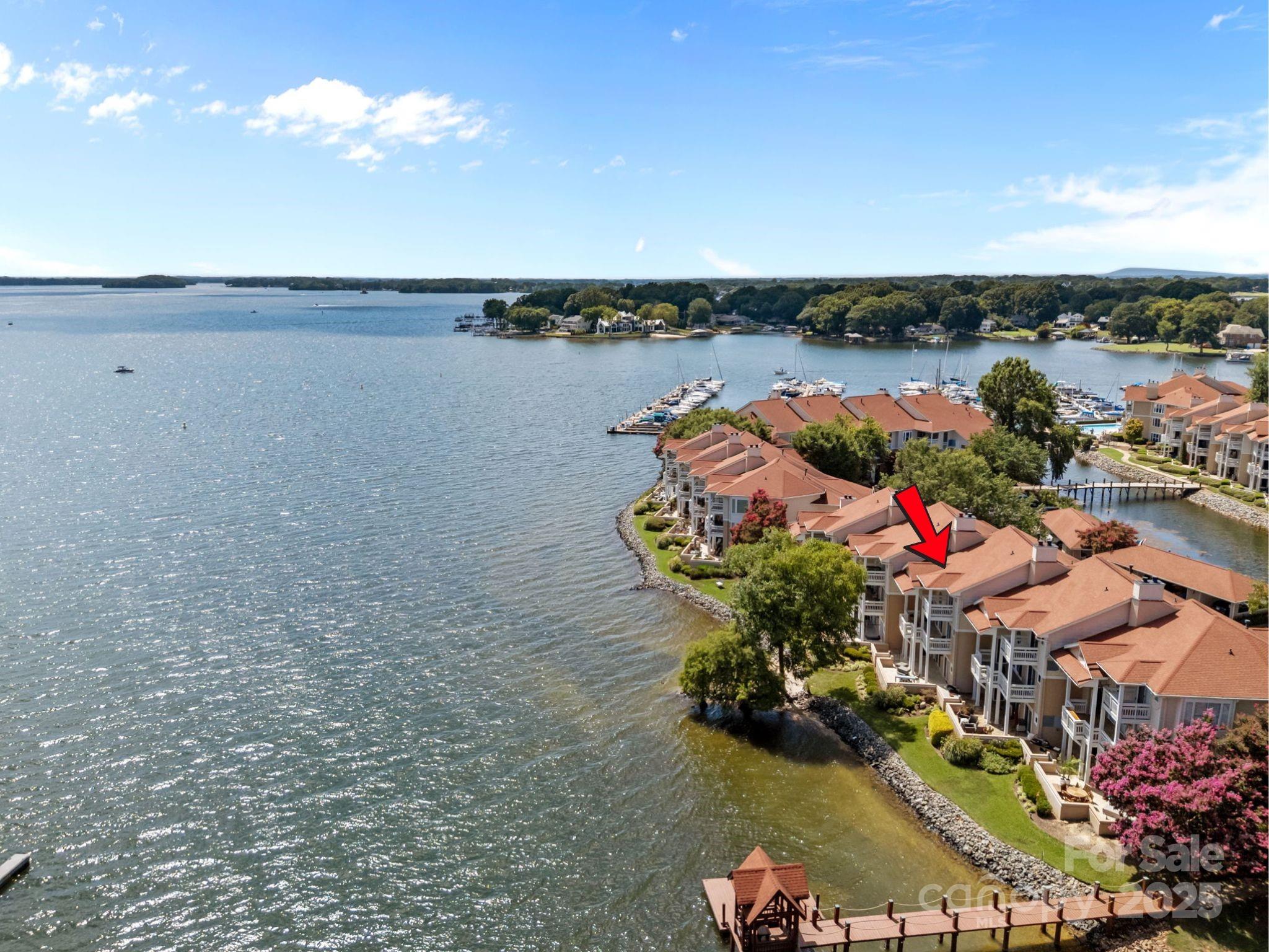 17925 Kings Point Drive, Unit F Cornelius, NC 28031 - Photo 1 of 35 a view of a lake with plants