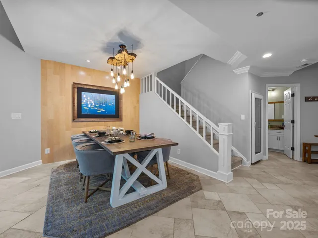 a view of a livingroom with furniture and a workspace