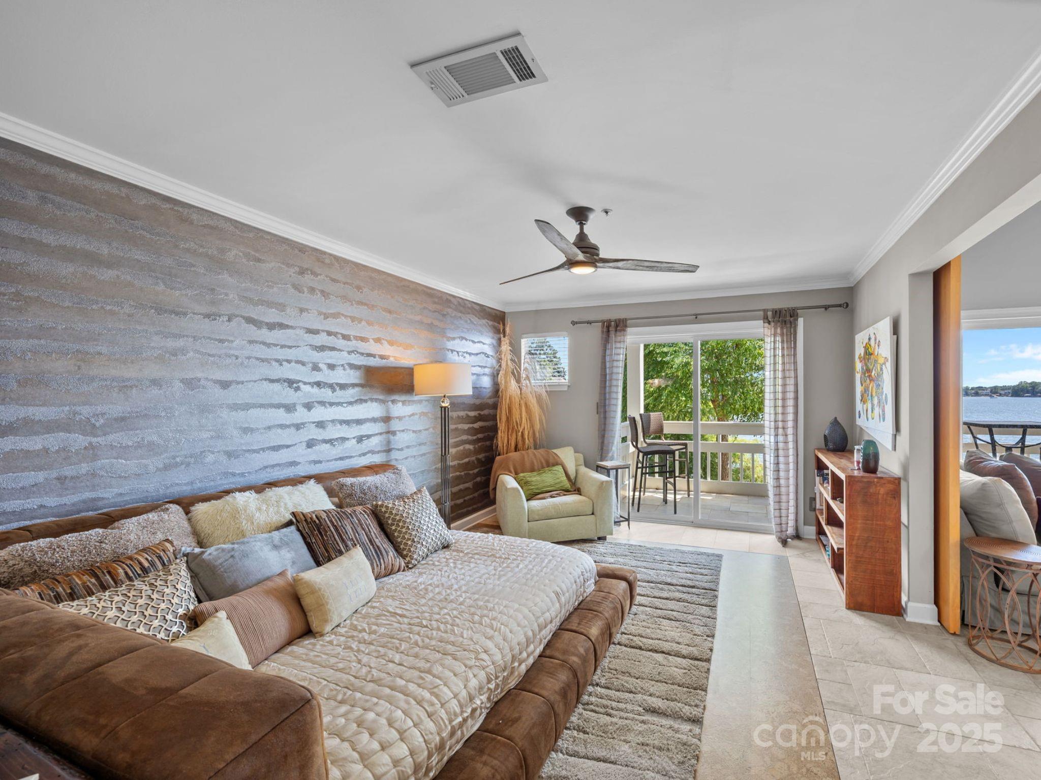 17925 Kings Point Drive, Unit F Cornelius, NC 28031 - Photo 18 of 35 a living room with furniture and a fireplace