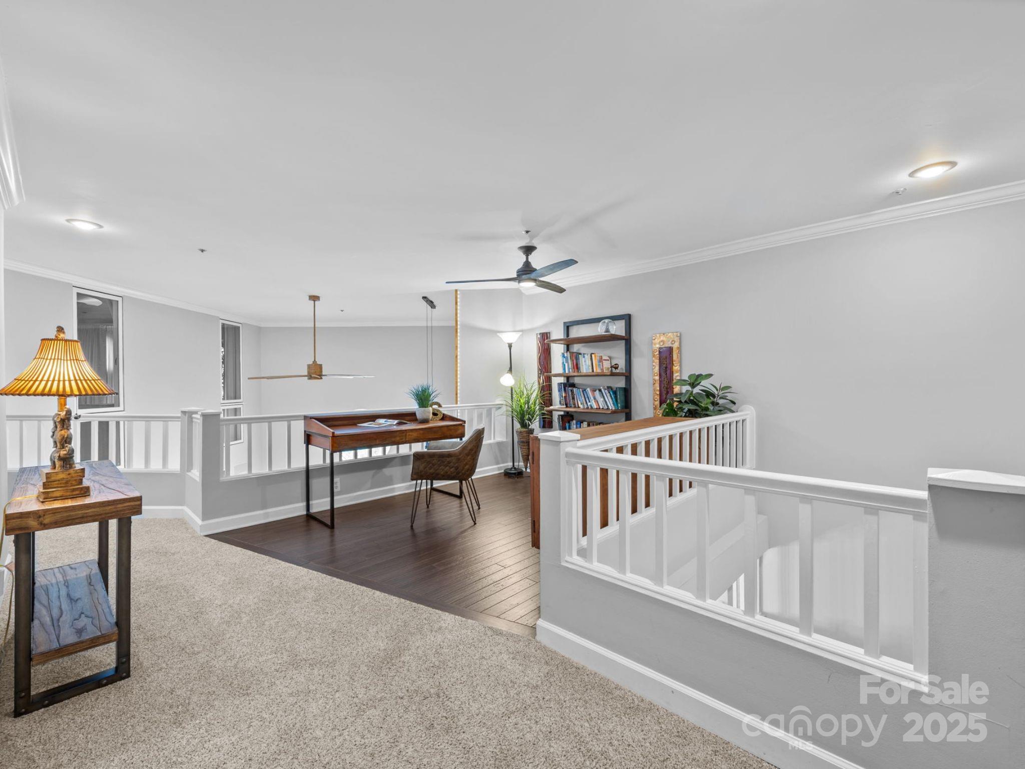17925 Kings Point Drive, Unit F Cornelius, NC 28031 - Photo 20 of 35 a living room with furniture and a table