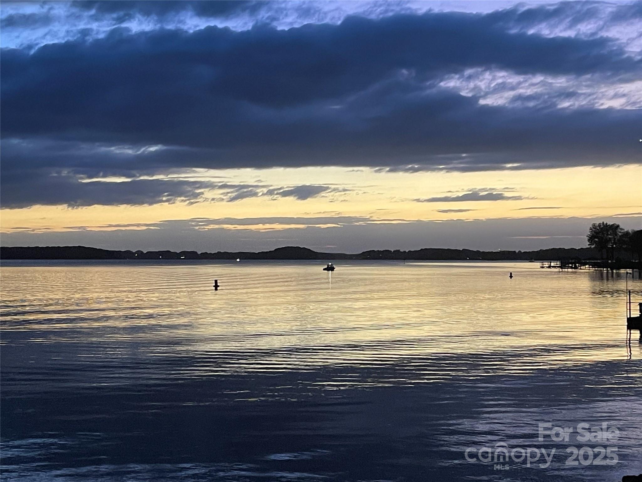 17925 Kings Point Drive, Unit F Cornelius, NC 28031 - Photo 2 of 35 a view of an ocean and beach