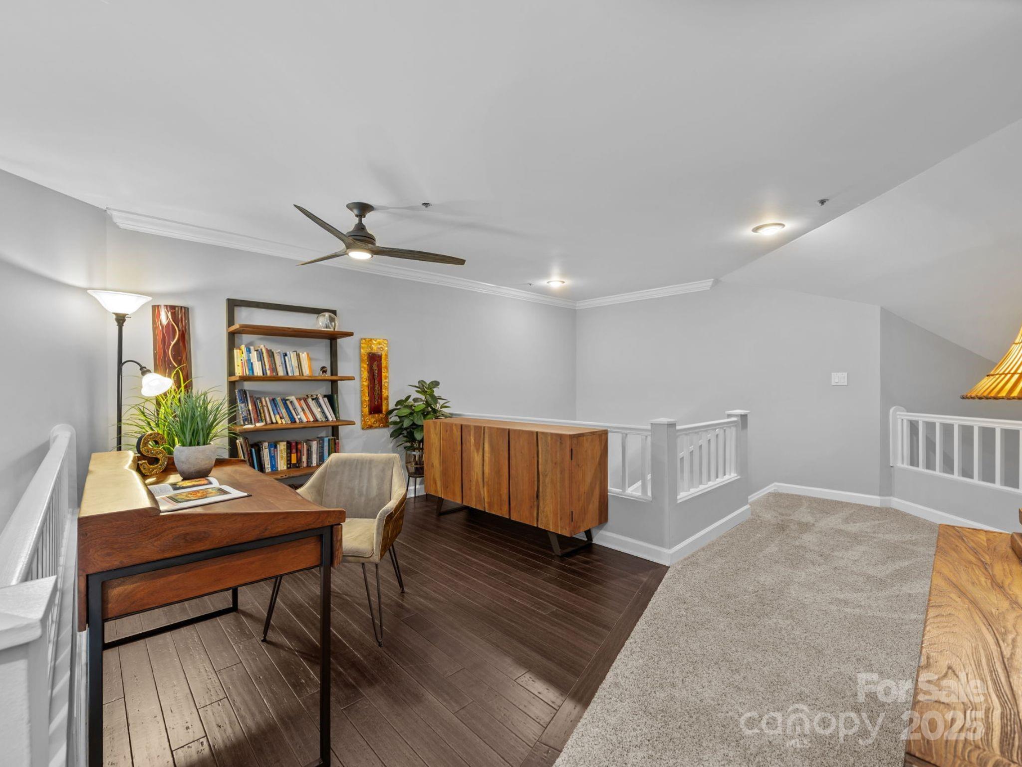 17925 Kings Point Drive, Unit F Cornelius, NC 28031 - Photo 21 of 35 a living room with furniture and a wooden floor
