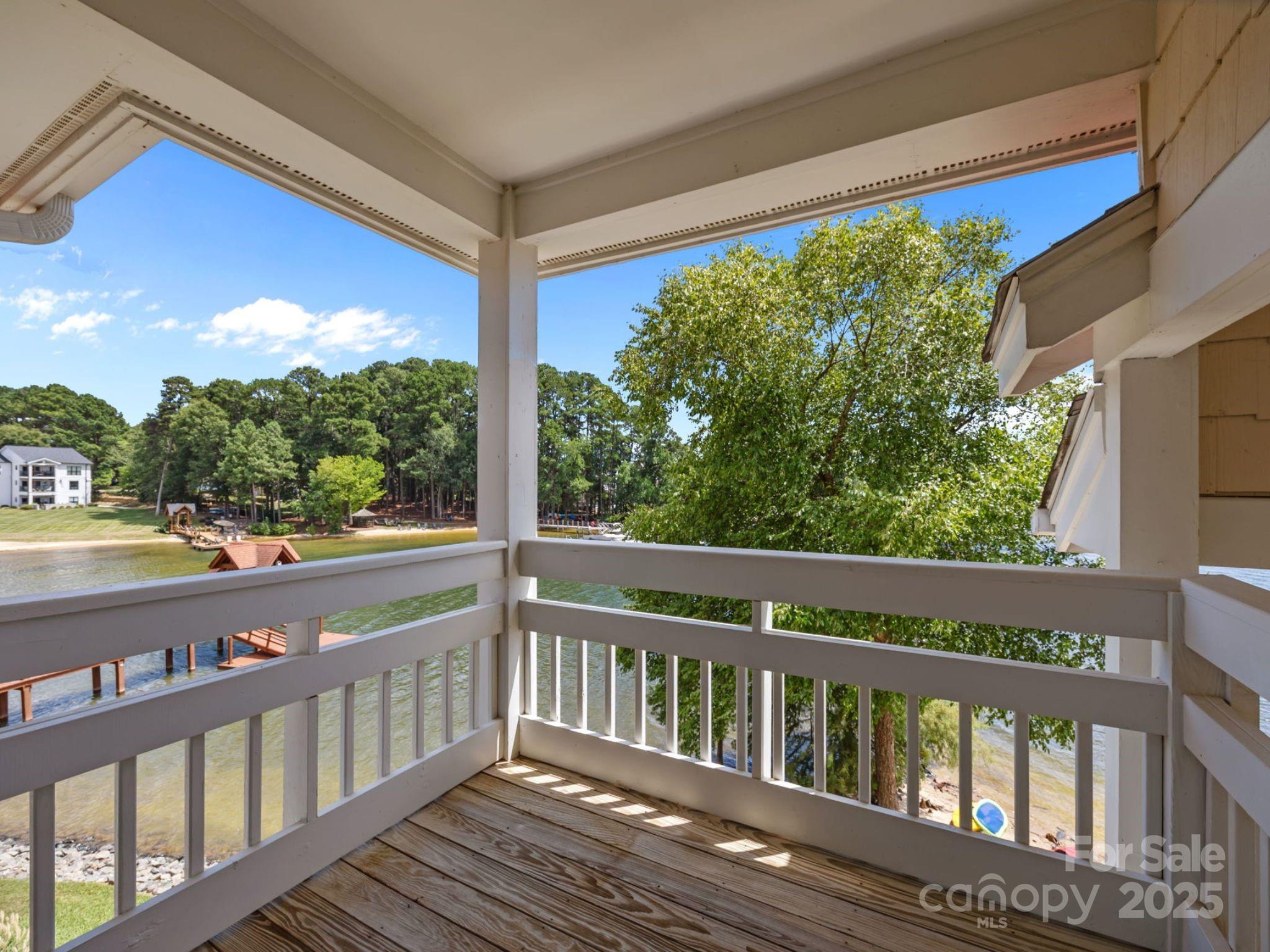 17925 Kings Point Drive, Unit F Cornelius, NC 28031 - Photo 28 of 35 a view of a wooden deck