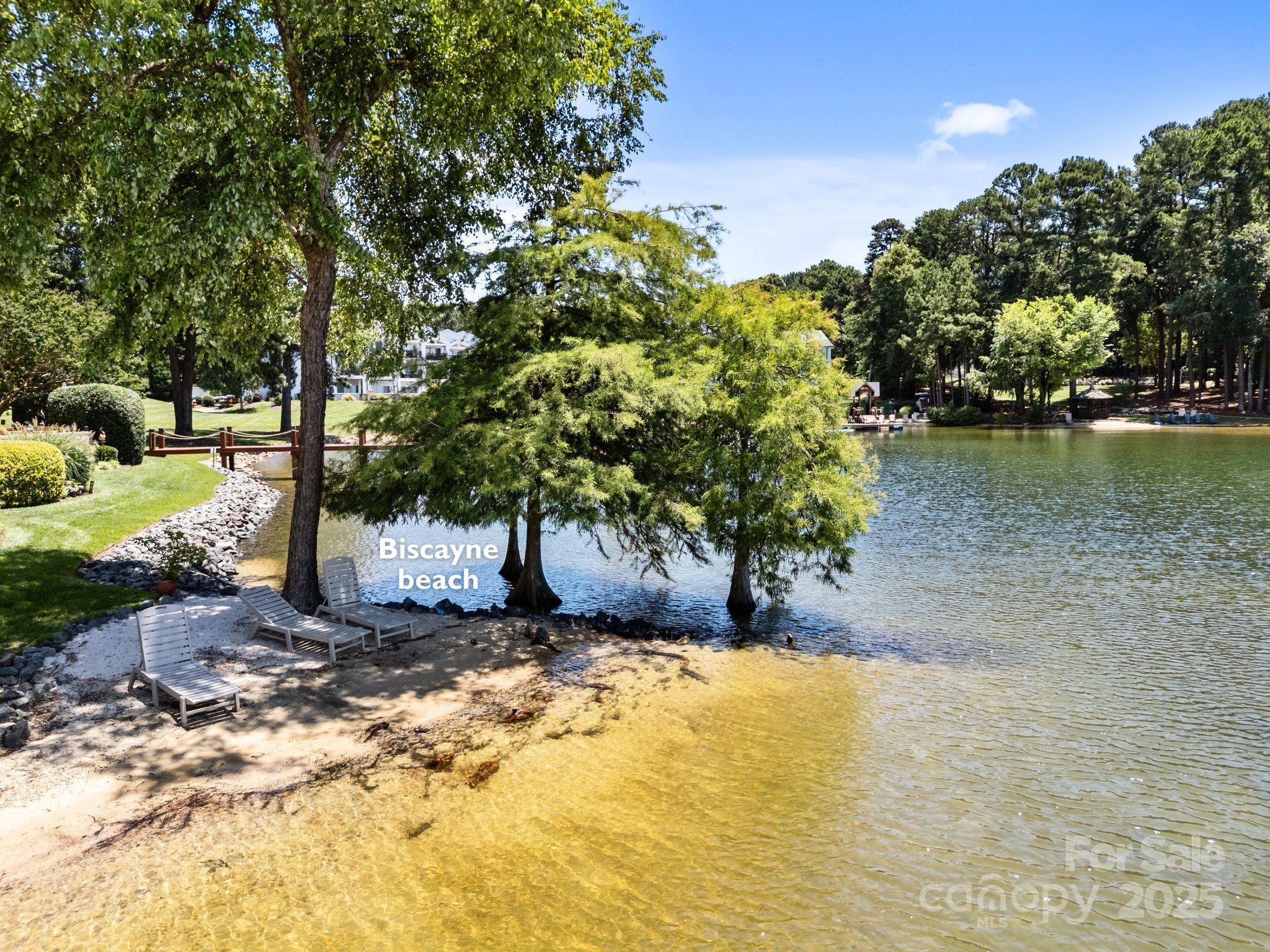 17925 Kings Point Drive, Unit F Cornelius, NC 28031 - Photo 32 of 35 a view of a yard with trees