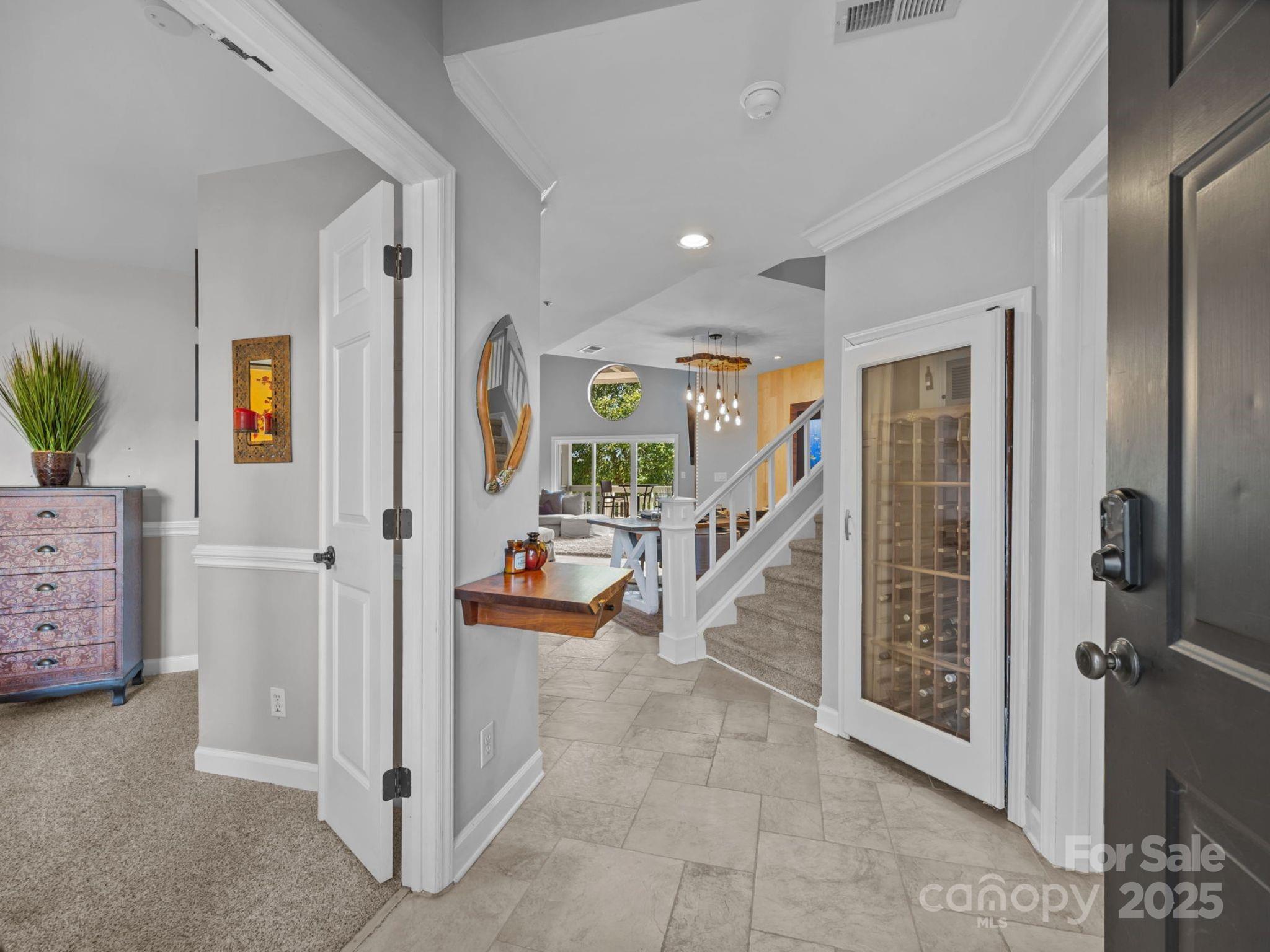 17925 Kings Point Drive, Unit F Cornelius, NC 28031 - Photo 5 of 35 a view of a hallway with livingroom and furniture