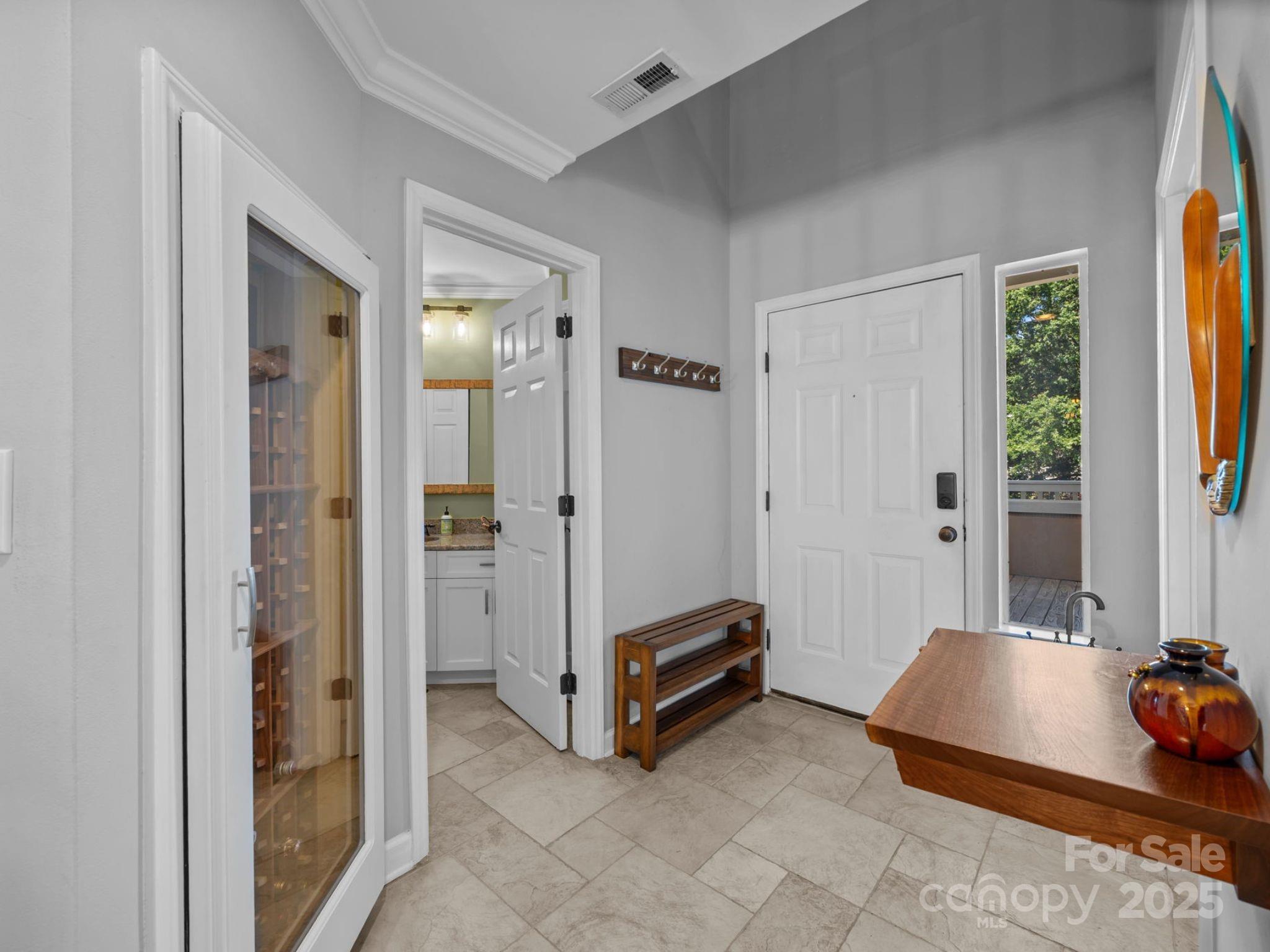 17925 Kings Point Drive, Unit F Cornelius, NC 28031 - Photo 6 of 35 a living room with furniture and a window