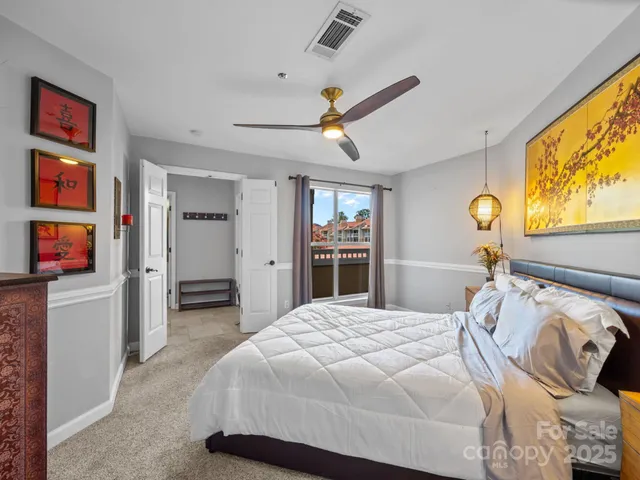 a bedroom with a bed and a book shelf
