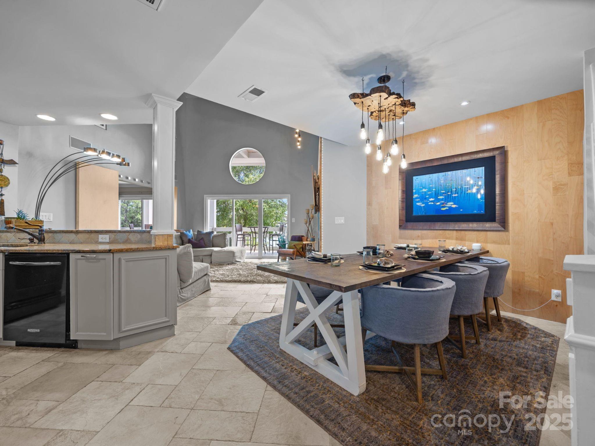 17925 Kings Point Drive, Unit F Cornelius, NC 28031 - Photo 9 of 35 a view of a dining room with furniture window and wooden floor