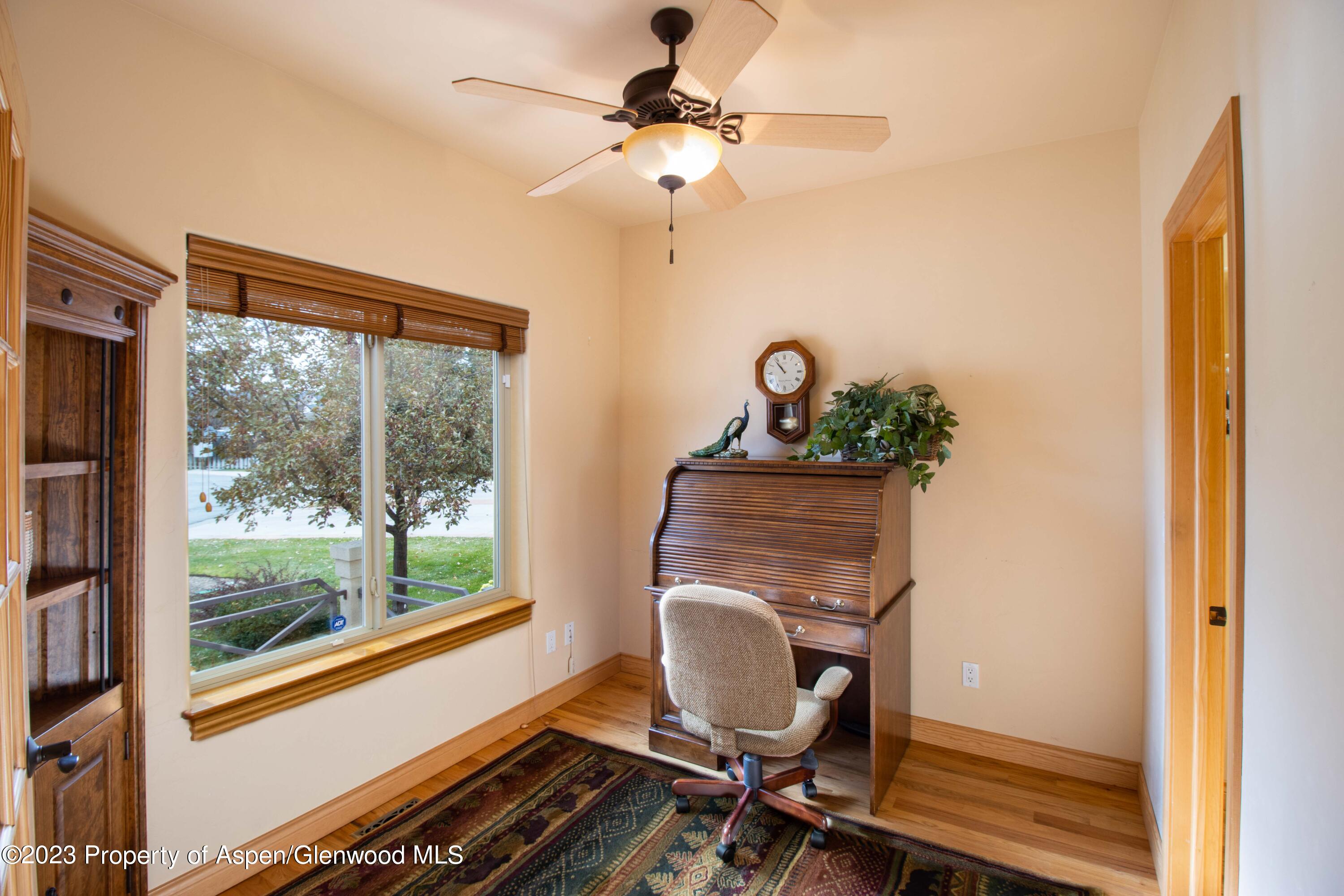 1413 Fir Court Rifle, CO 81650 - Photo 12 of 23 a work room with furniture and a window