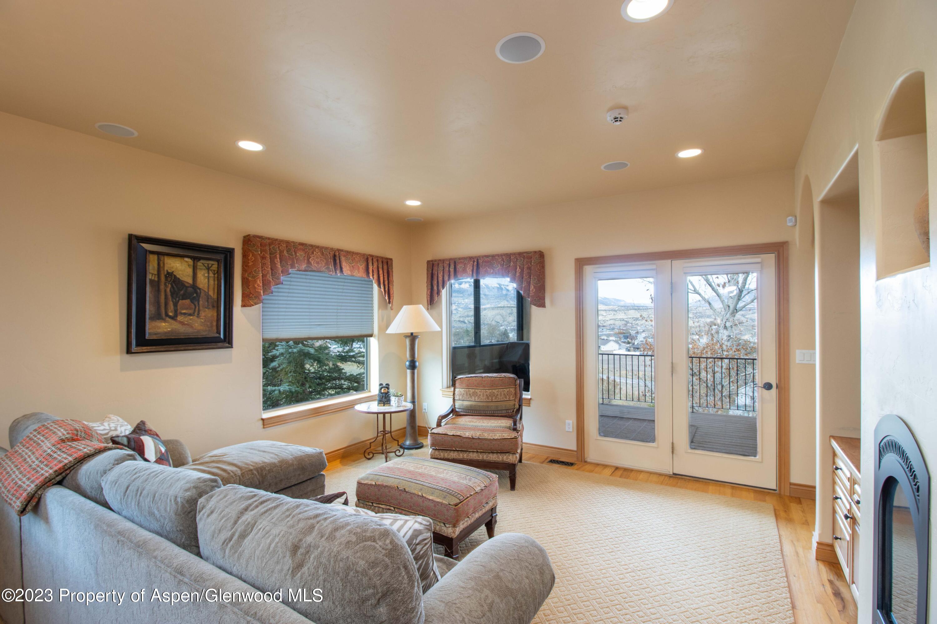 1413 Fir Court Rifle, CO 81650 - Photo 14 of 23 a living room with furniture and a large window