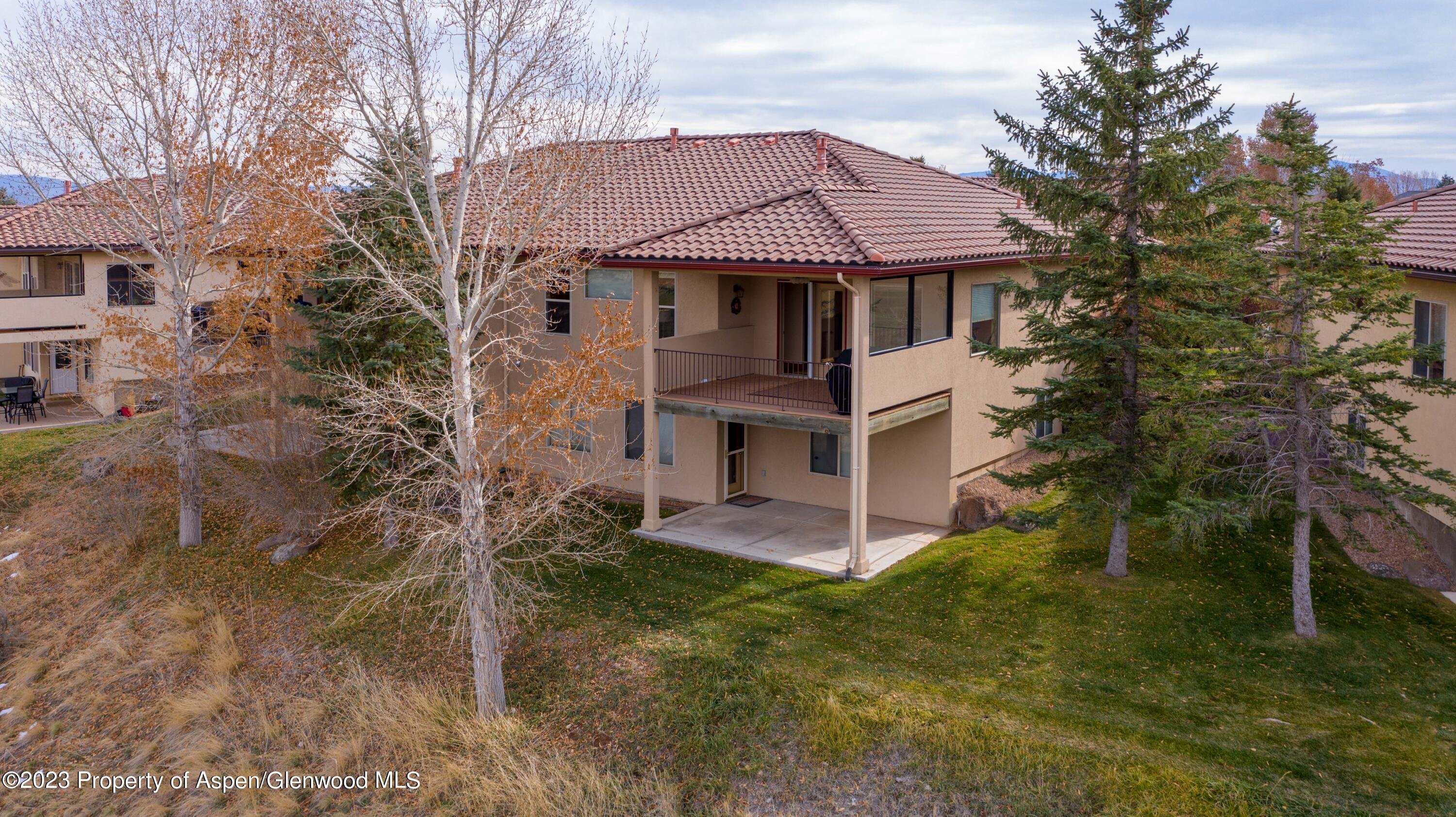 1413 Fir Court Rifle, CO 81650 - Photo 2 of 23 a front view of a house with a garden