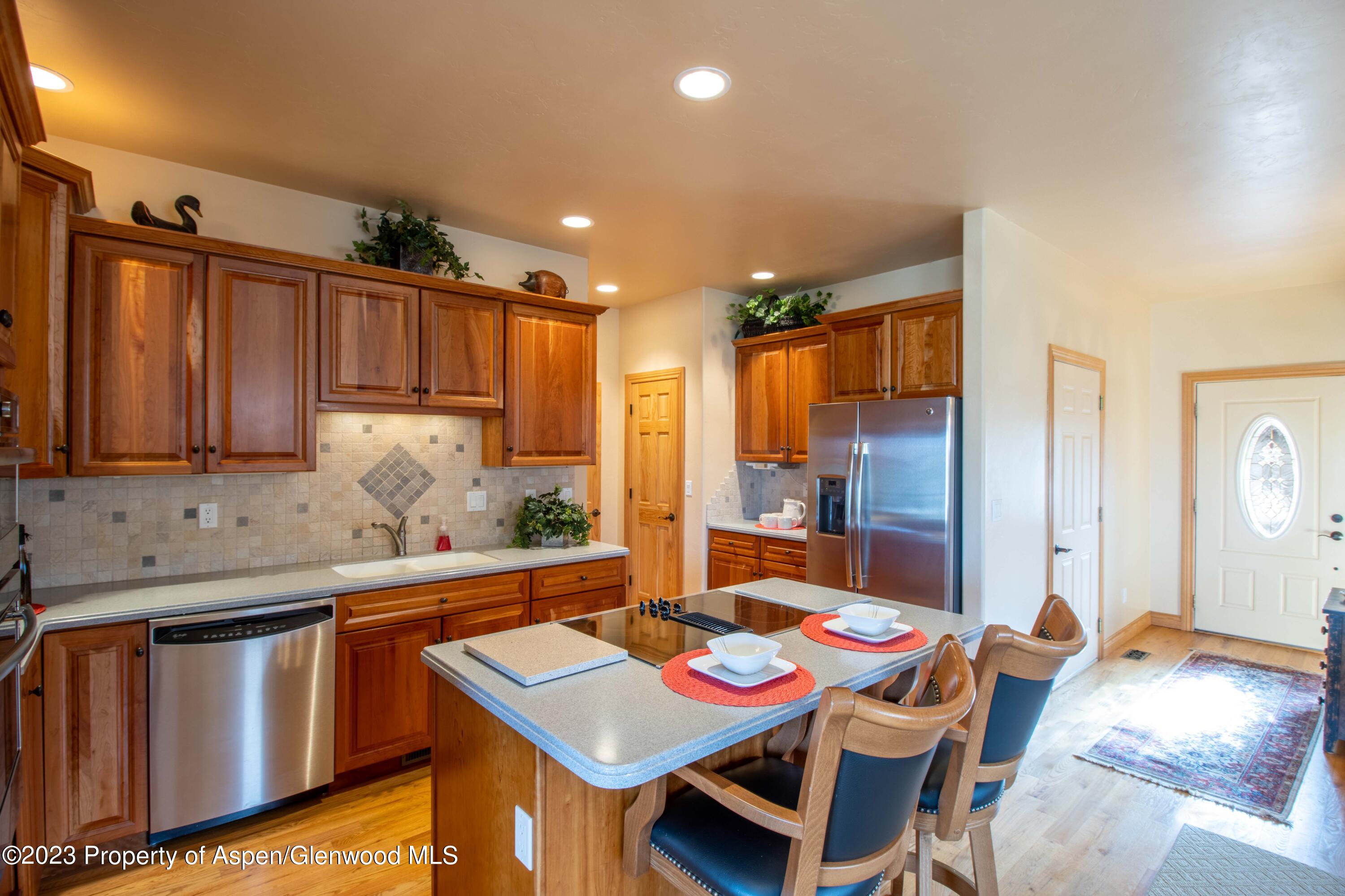 1413 Fir Court Rifle, CO 81650 - Photo 4 of 23 a kitchen that has a table and chairs in it