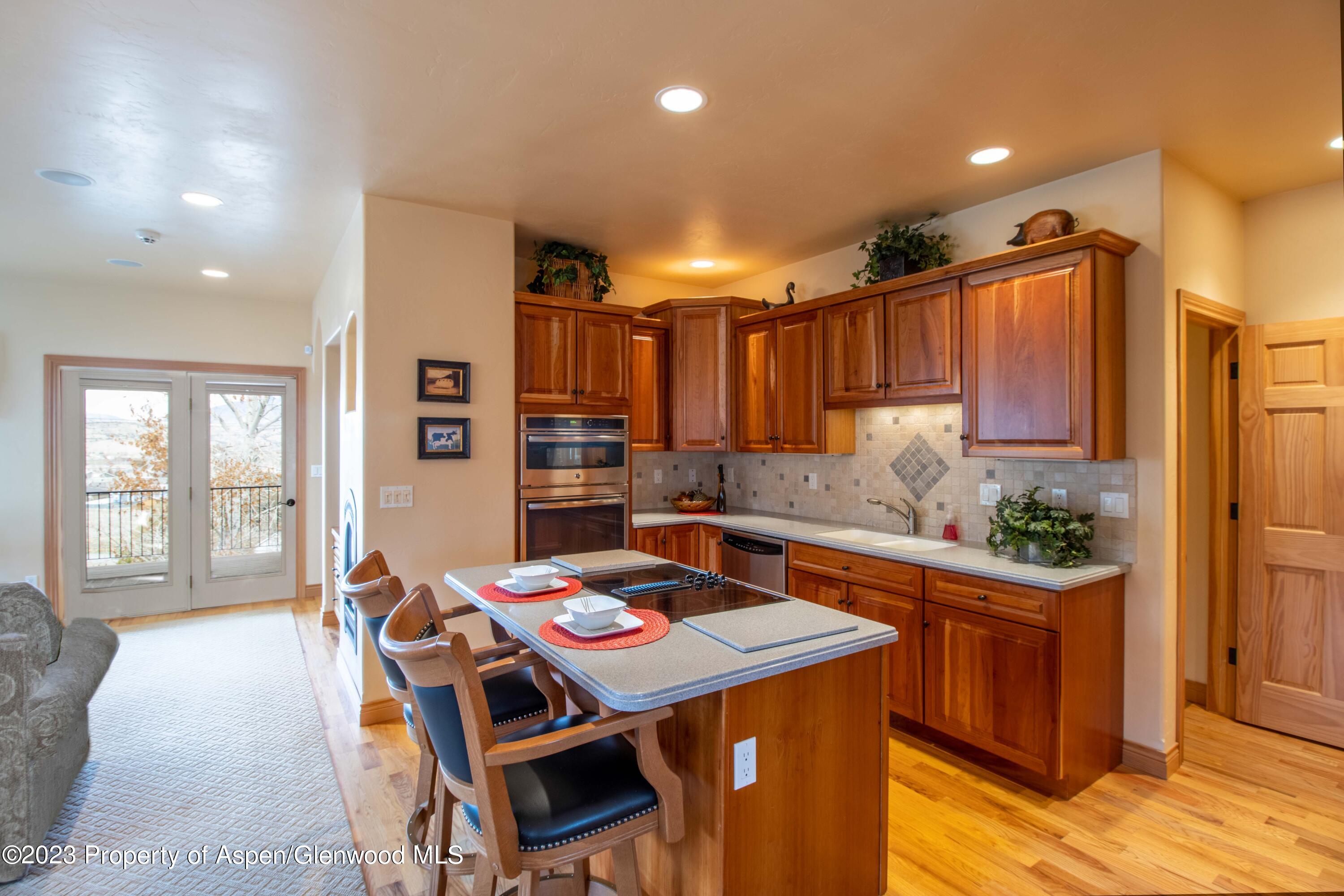 1413 Fir Court Rifle, CO 81650 - Photo 5 of 23 a kitchen that has a table and chairs in it