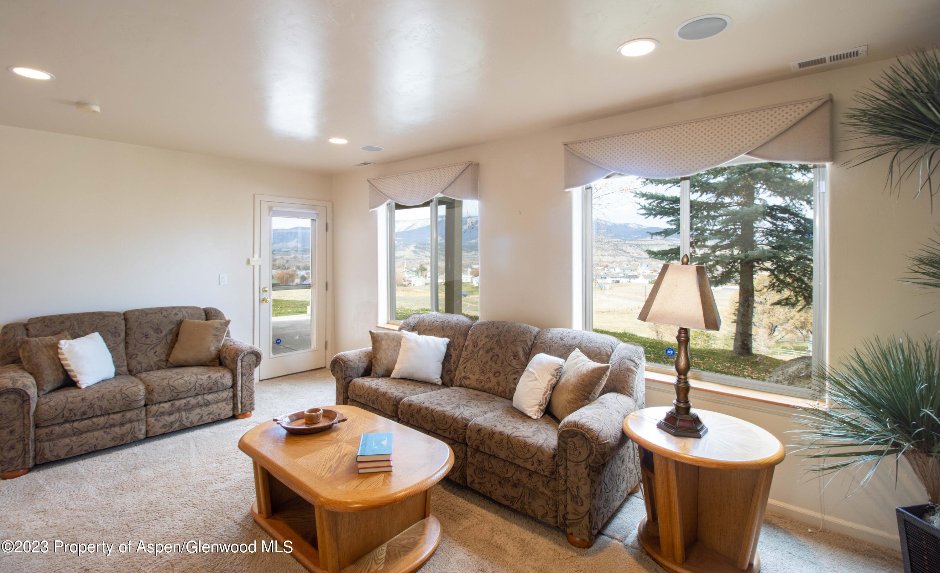 1413 Fir Court Rifle, CO 81650 - Photo 6 of 23 a living room with furniture and a large window