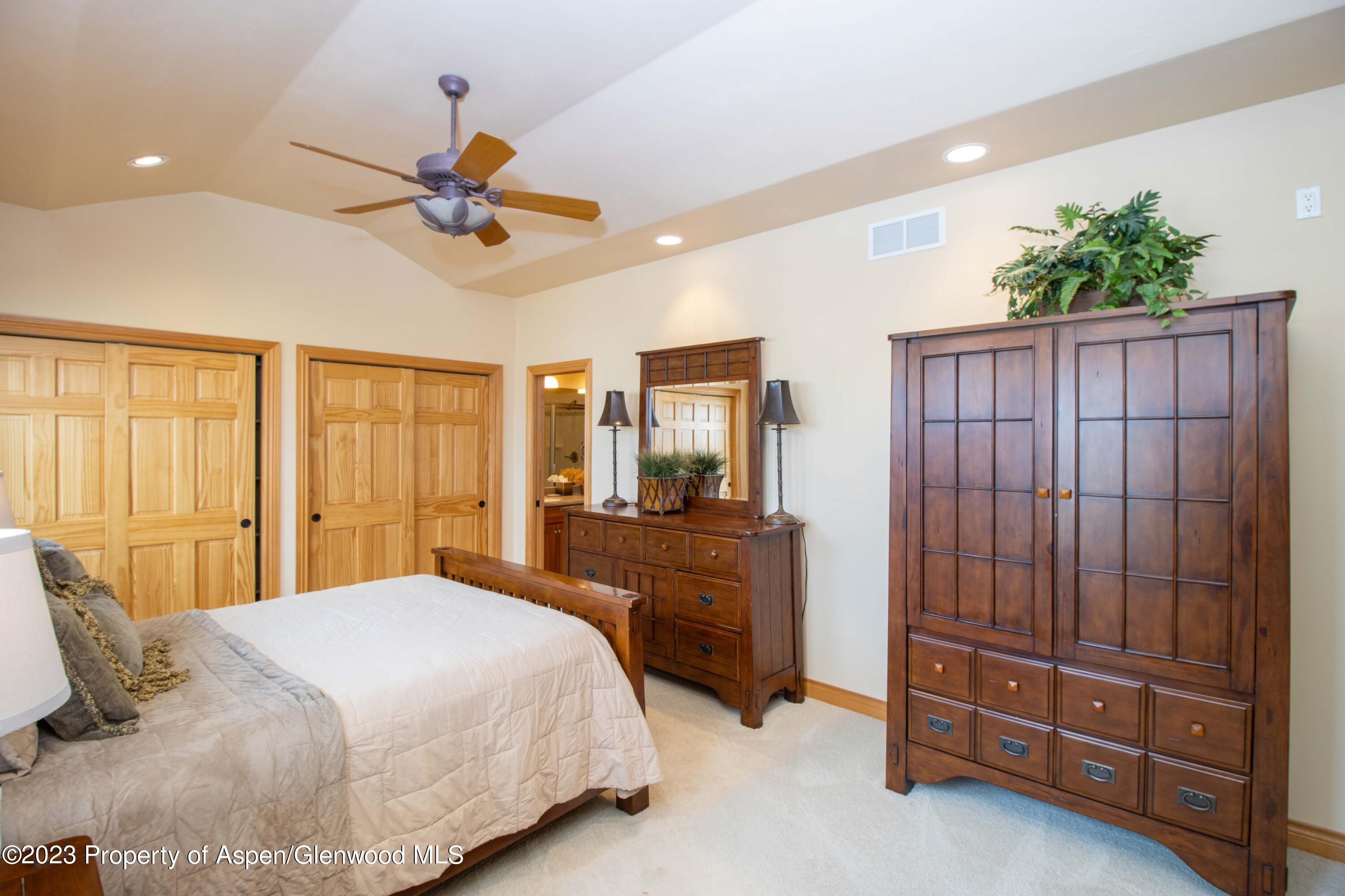 1413 Fir Court Rifle, CO 81650 - Photo 9 of 23 a bedroom with a bed and a dresser