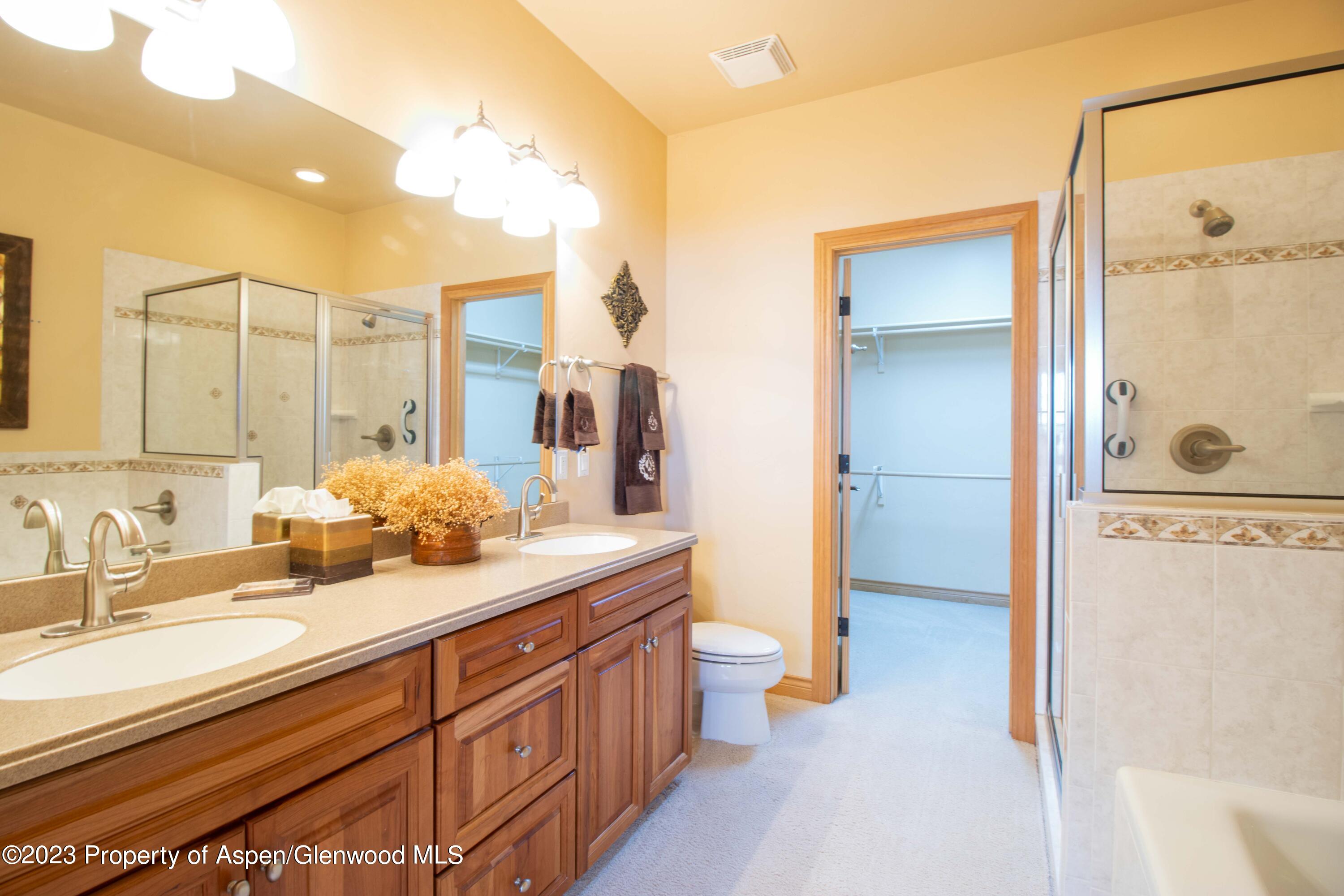 1413 Fir Court Rifle, CO 81650 - Photo 10 of 23 a bathroom with a sink and a mirror