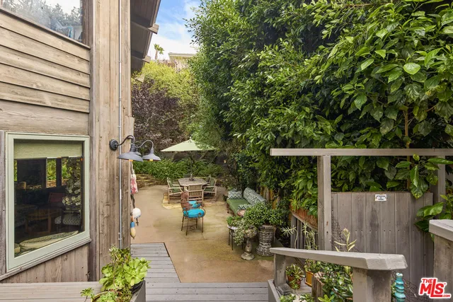 a view of a balcony with plants