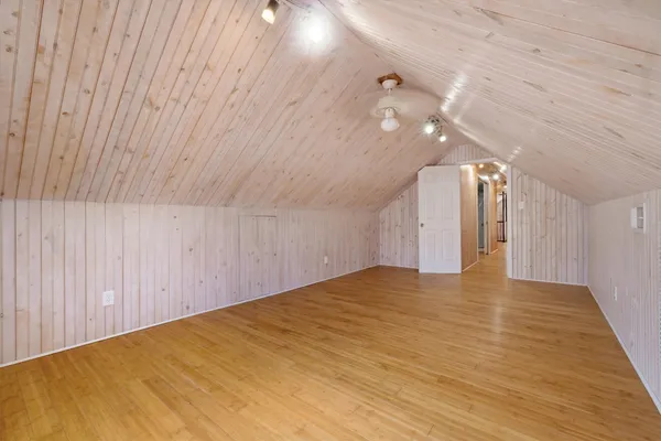 a view of a room with wooden walls