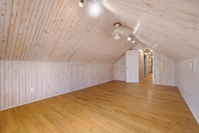 a view of a room with wooden walls