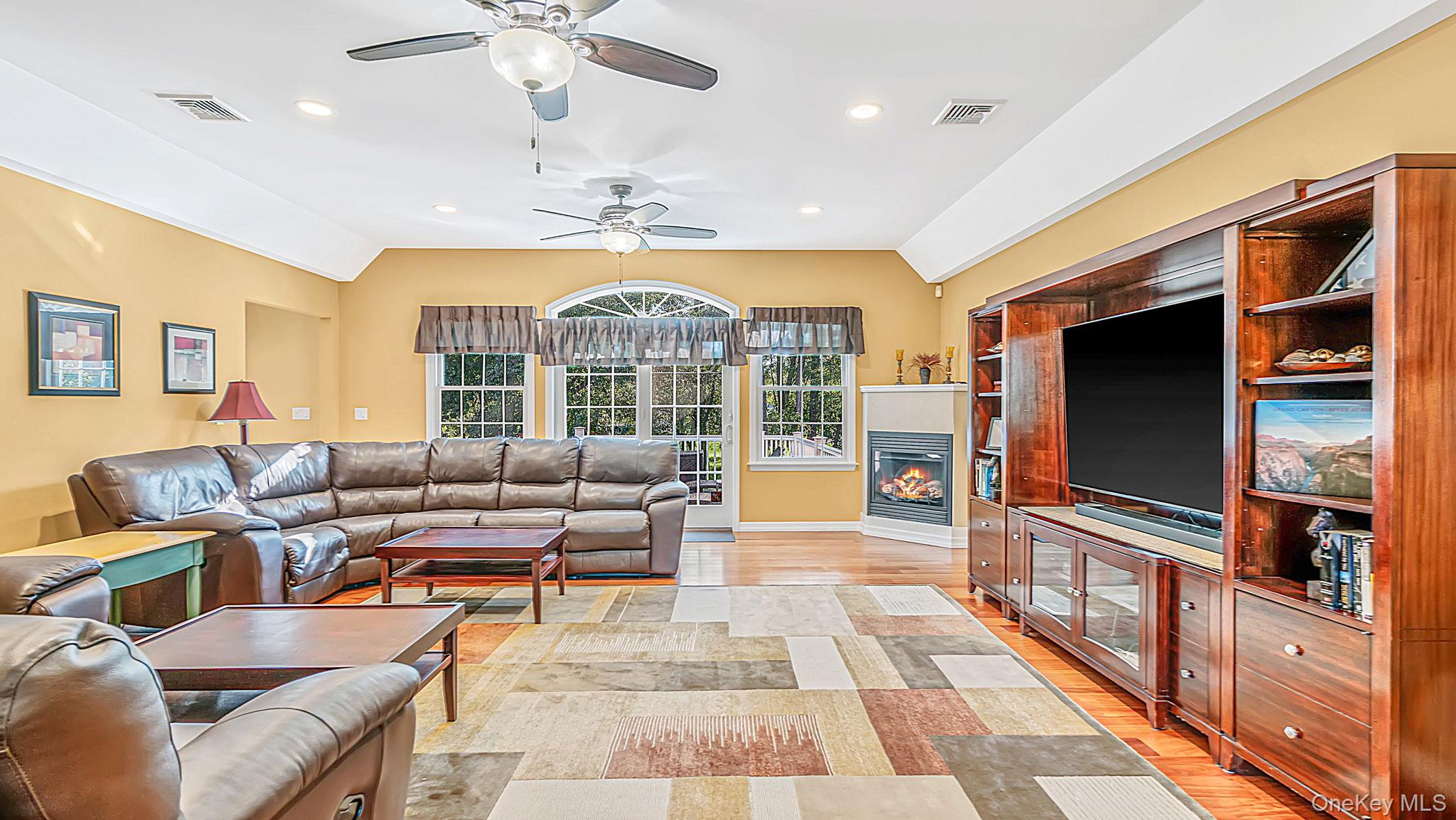 11 Valentine Road Shoreham, NY 11786 - Photo 2 of 40 Vaulted ceiling, recessed lighting, wood flooring, corner propane fireplace