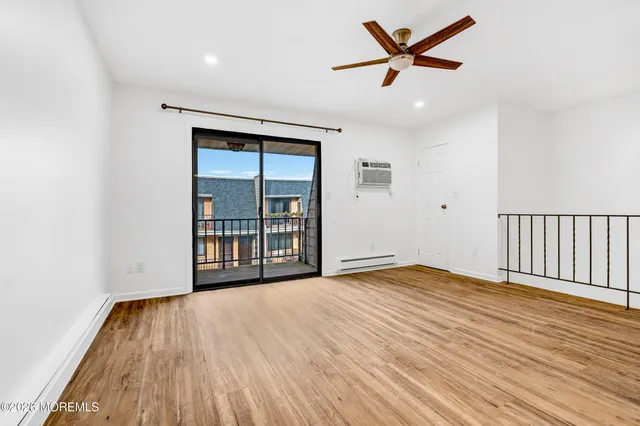 a view of a balcony with wooden floor