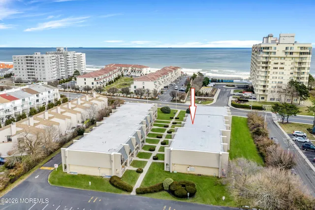 a view of a city with an ocean view