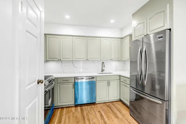 a kitchen with a stove and a microwave