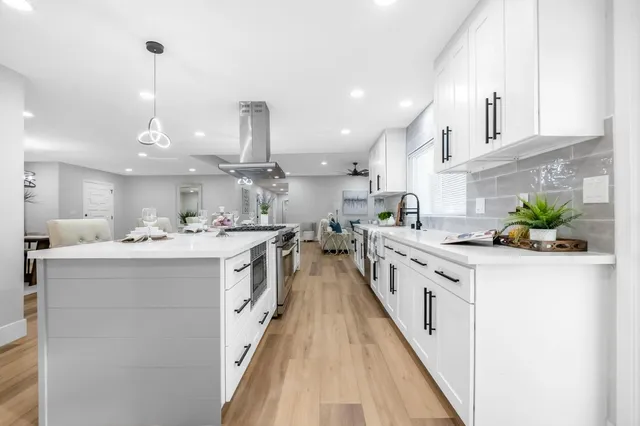 a kitchen with cabinets and appliances