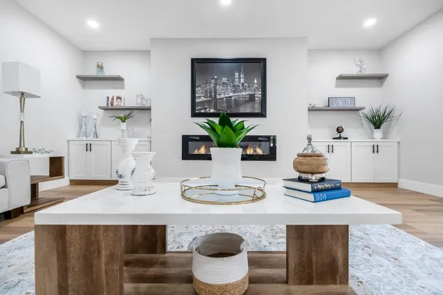 a kitchen with stainless steel appliances kitchen island granite countertop a table and chairs in it