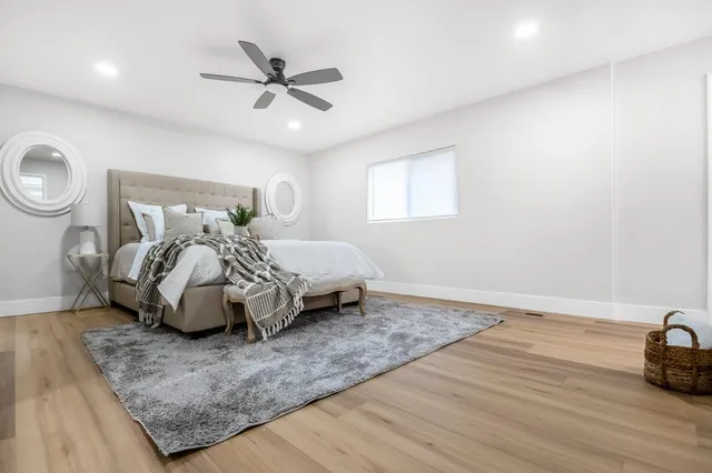 a bedroom with a bed and window