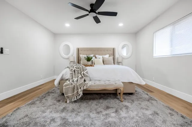 a bed room with a bed and a window