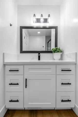 a bathroom with a sink and a mirror