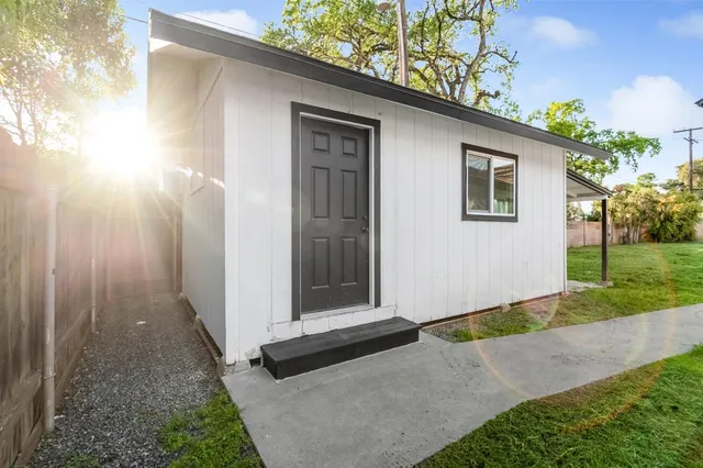 a front view of a house with garden