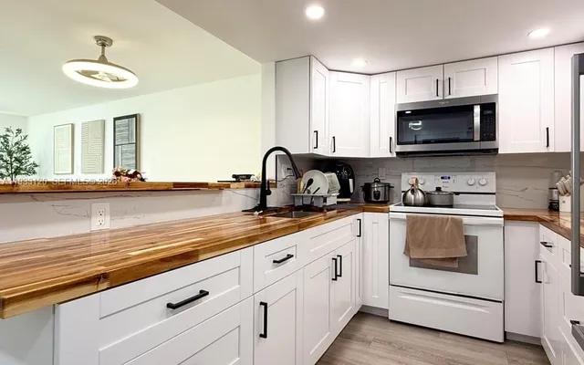 a kitchen with a sink and cabinets