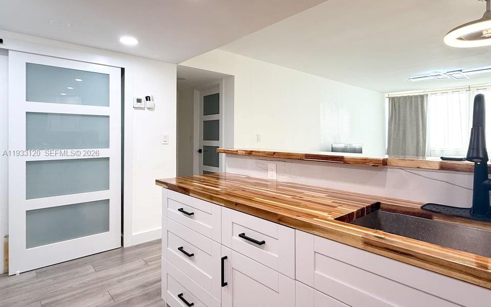 9125 Southwest 77th Avenue, Unit 307 Miami, FL 33156 - Photo 21 of 21 a kitchen with a sink and cabinets