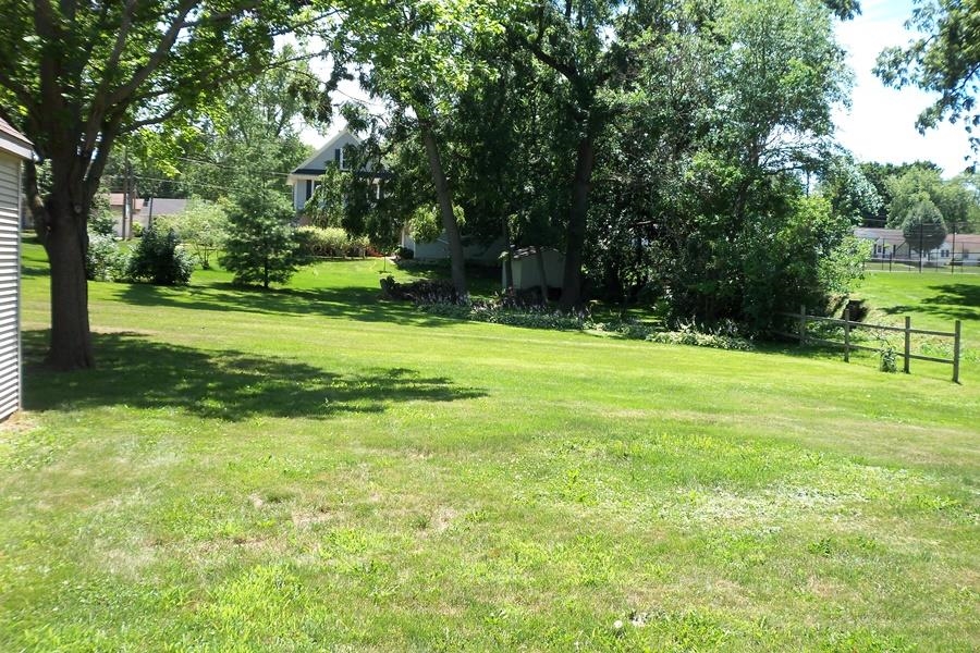 1210 South Prairie Avenue Freeport, IL 61032 - Photo 22 of 22 a view of a big yard with a trees