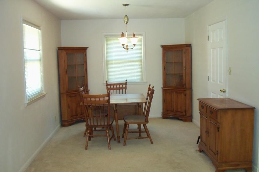 1210 South Prairie Avenue Freeport, IL 61032 - Photo 4 of 22 a view of a dining room with furniture and window
