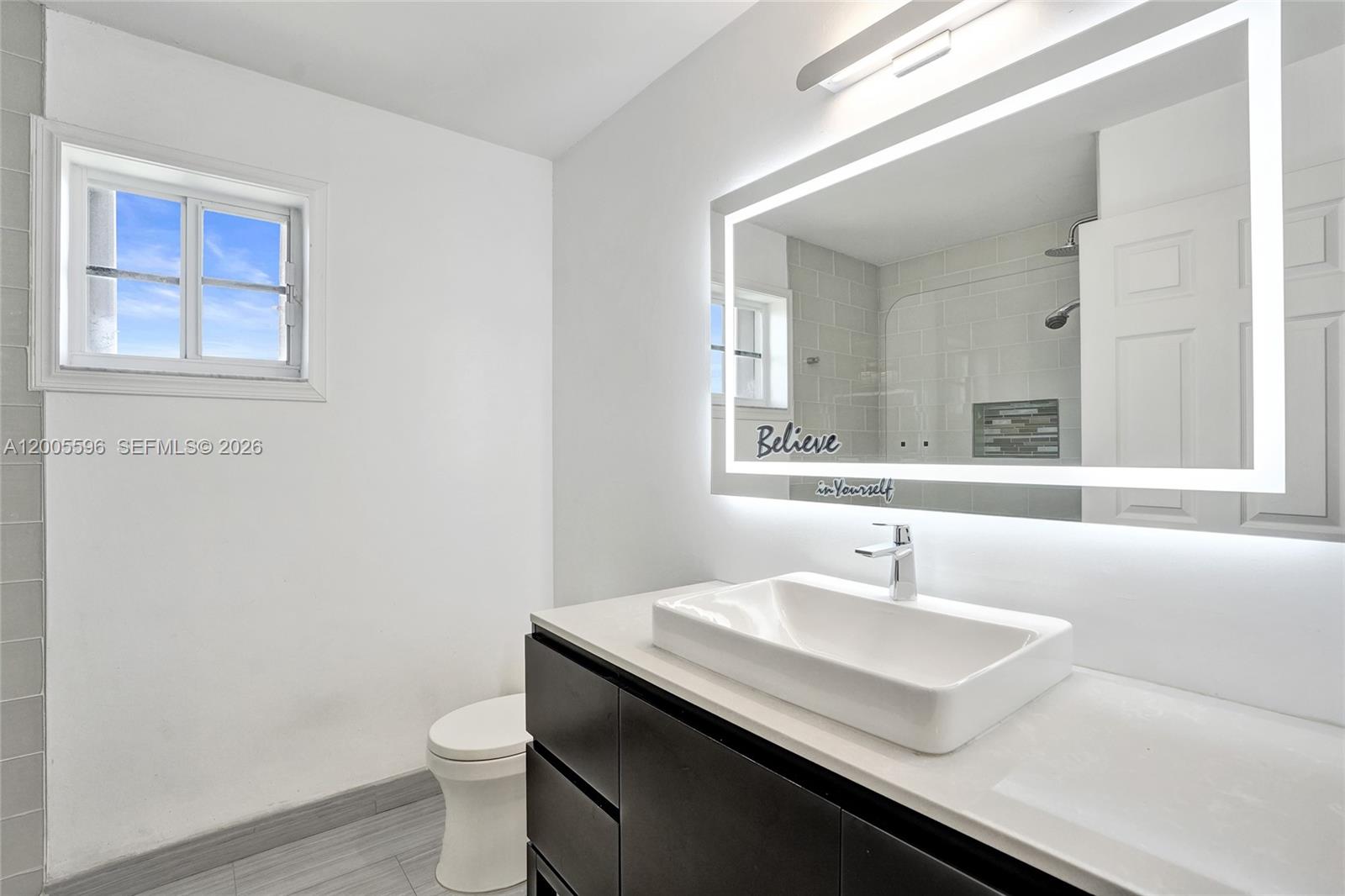 4281 Laurel Ridge Circle Weston, FL 33331 - Photo 58 of 80 a bathroom with a sink and a toilet