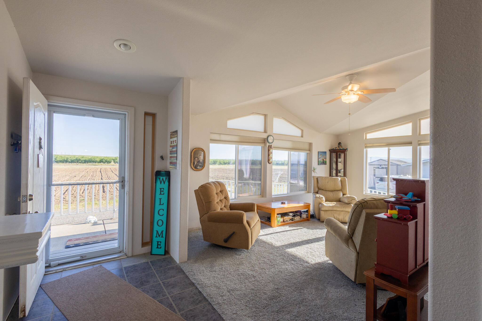 20735 Gyle Road Corning, CA 96021 - Photo 5 of 39 a living room with furniture and a large window