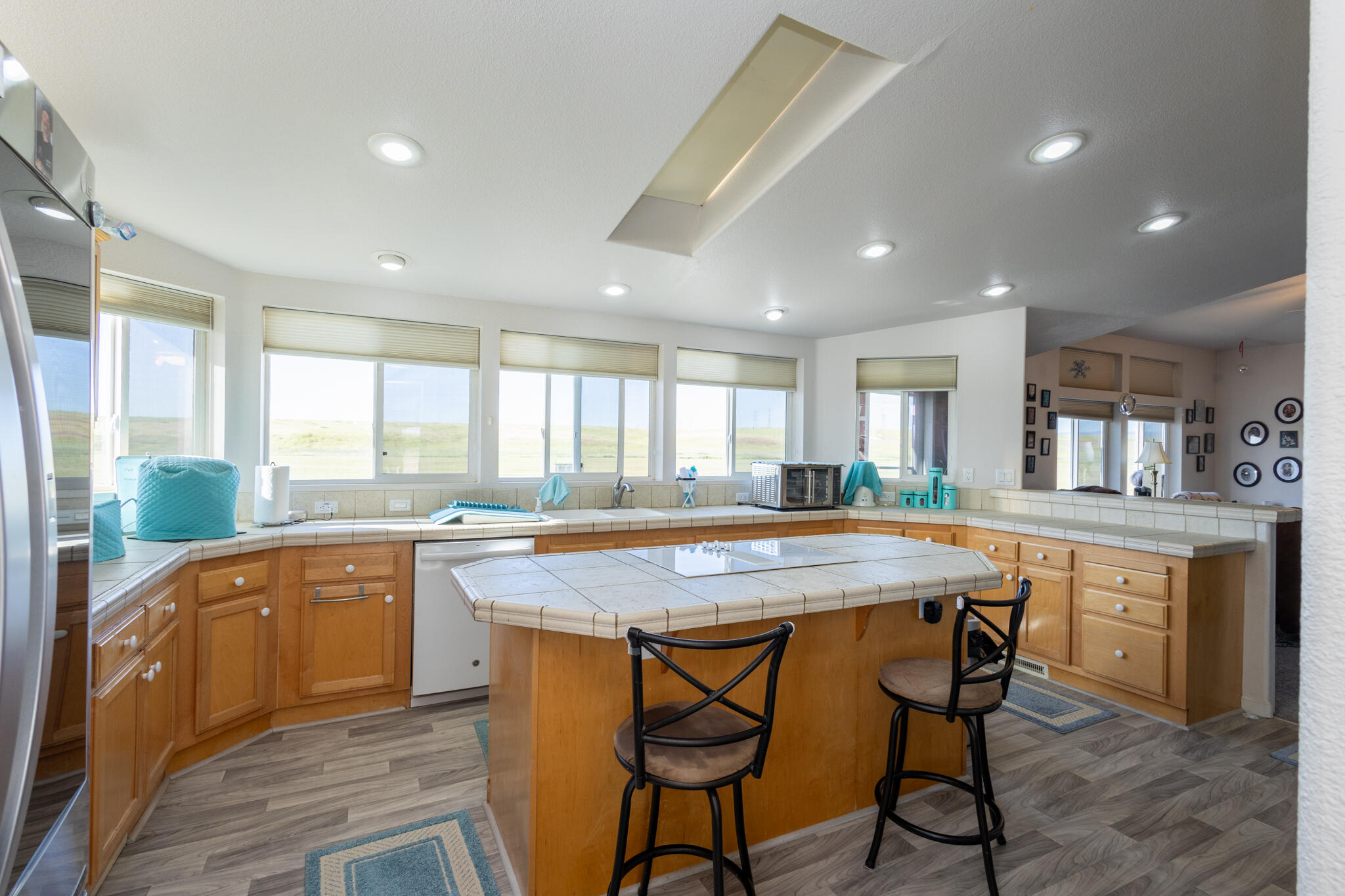 20735 Gyle Road Corning, CA 96021 - Photo 9 of 39 a kitchen with a table chairs sink and cabinets