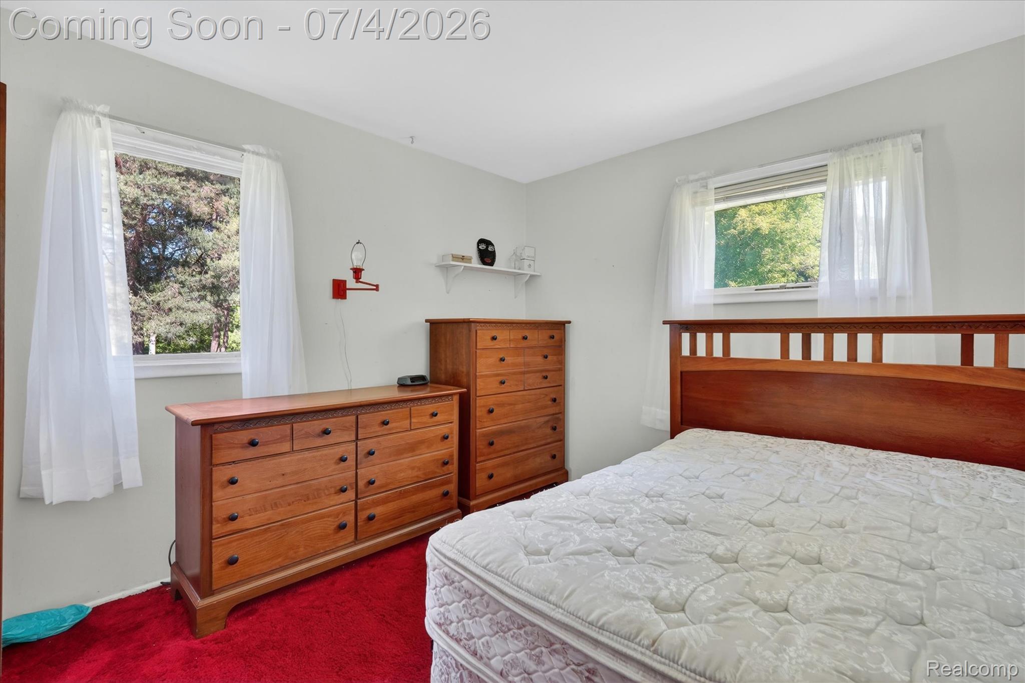 2091 North Irish Road Davison, MI 48423 - Photo 11 of 25 Bedroom featuring light gray walls, two windows, and red carpet flooring