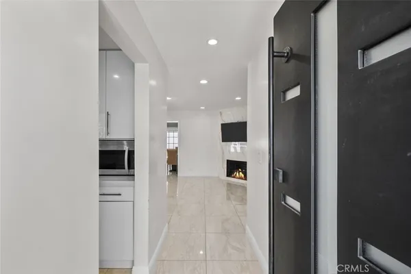 a view of a kitchen with an oven and refrigerator