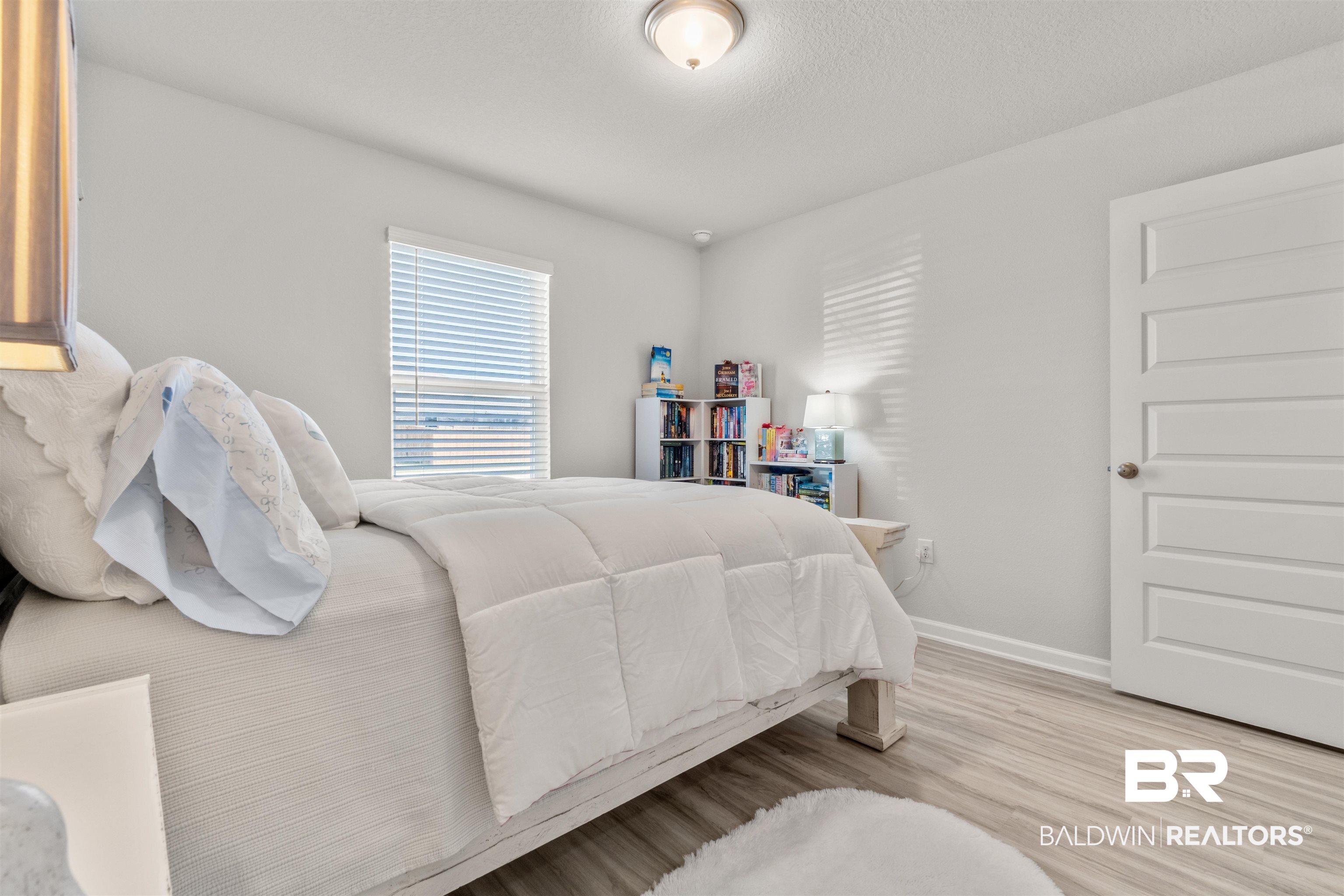24472 Ringneck Loop Elberta, AL 36530 - Photo 35 of 46 Bedroom with a textured ceiling and light hardwood / wood-style flooring