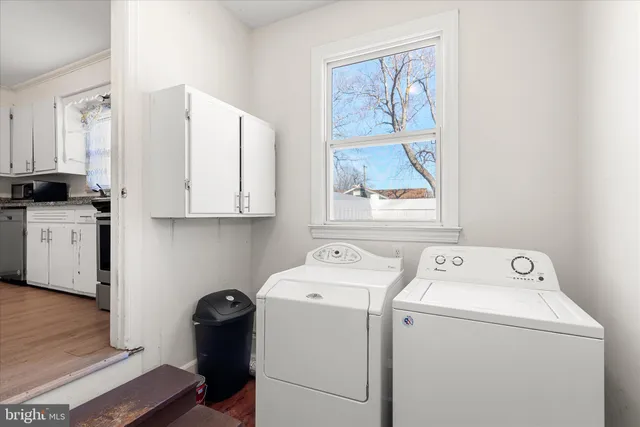 a utility room with dryer and washer